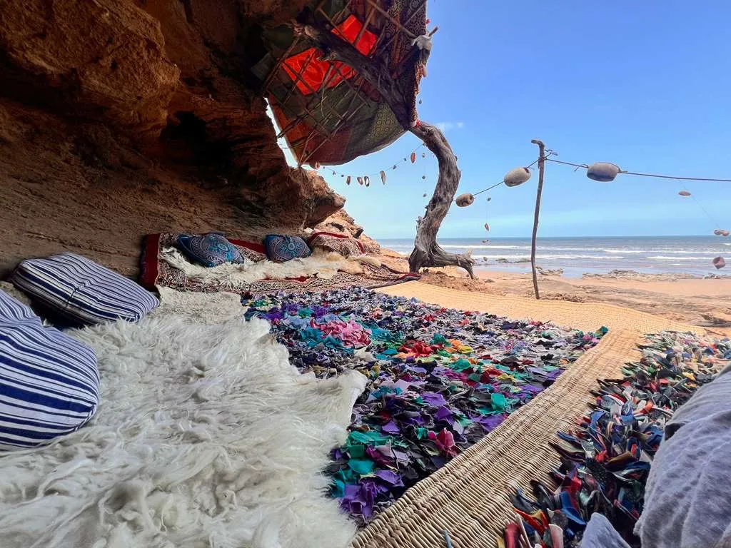 Rugs and cushions in a seaside cave