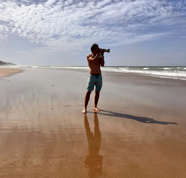 Photographer on the wild beach of Sidi M'Barek